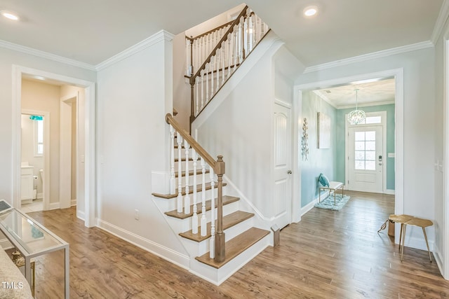 40 Two Creeks Loop, Chapel Hill, NC 27517 - staircase featuring wood finished floors, ornamental molding, and recessed lighting