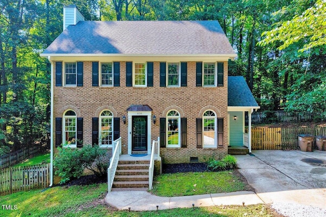 838 Joyner Ct, Wake Forest, NC 27587 - view of front facade featuring a chimney and brick siding