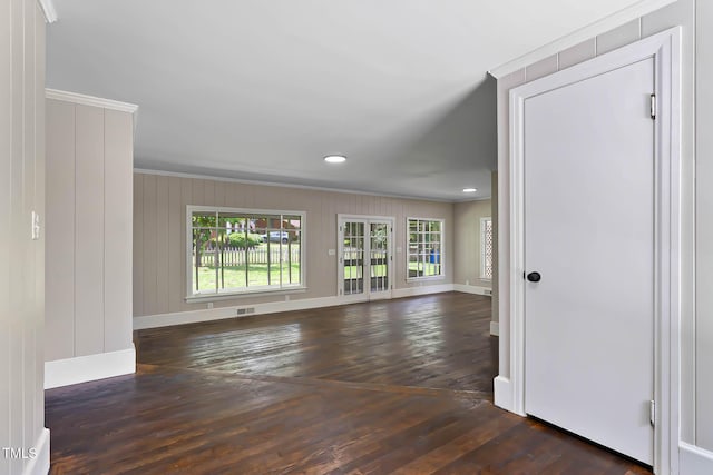 519 W Raleigh St, Siler City, NC 27344 - spare room featuring wood-type flooring, baseboards, ornamental molding, and recessed lighting