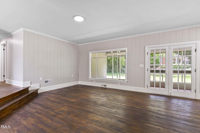 519 W Raleigh St, Siler City, NC 27344 - unfurnished room featuring crown molding, baseboards, and dark wood finished floors