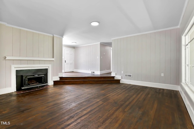519 W Raleigh St, Siler City, NC 27344 - unfurnished living room featuring ornamental molding, wood finished floors, baseboards, and a large fireplace