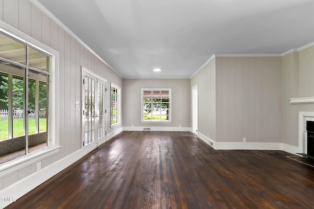 519 W Raleigh St, Siler City, NC 27344 - unfurnished living room with ornamental molding, baseboards, wood finished floors, and a fireplace