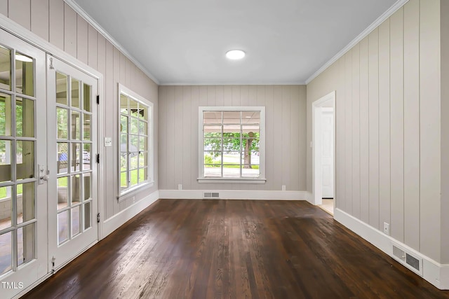 519 W Raleigh St, Siler City, NC 27344 - spare room featuring ornamental molding, dark wood-style flooring, and baseboards