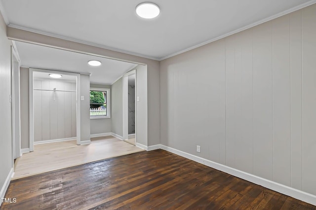 519 W Raleigh St, Siler City, NC 27344 - foyer with wood finished floors, baseboards, and crown molding