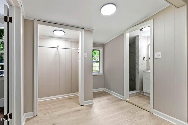 519 W Raleigh St, Siler City, NC 27344 - unfurnished bedroom featuring light wood finished floors, ornamental molding, baseboards, and connected bathroom