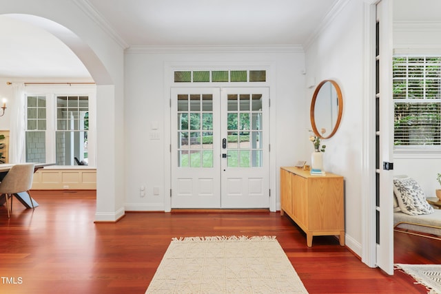 118 Killingsworth Dr, Cary, NC 27518 - foyer featuring arched walkways, ornamental molding, dark wood-style floors, baseboards, and french doors