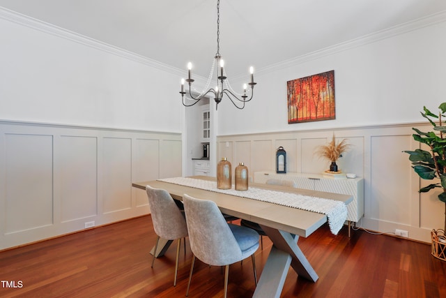 118 Killingsworth Dr, Cary, NC 27518 - dining area featuring a decorative wall, a chandelier, dark wood-style floors, crown molding, and a wainscoted wall