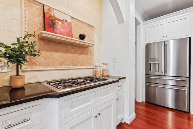 118 Killingsworth Dr, Cary, NC 27518 - kitchen featuring stainless steel appliances, dark wood-style floors, backsplash, white cabinets, and dark stone countertops