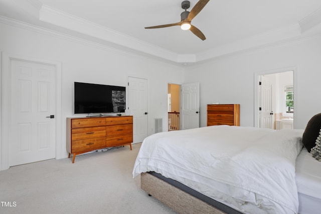 118 Killingsworth Dr, Cary, NC 27518 - bedroom with a raised ceiling, crown molding, light carpet, connected bathroom, and a ceiling fan