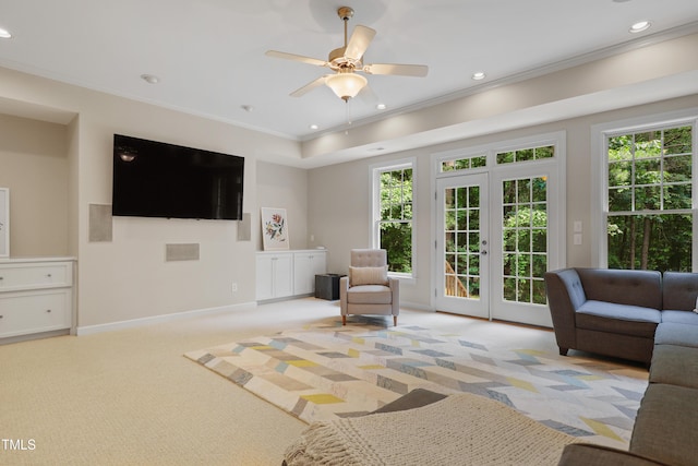 118 Killingsworth Dr, Cary, NC 27518 - living area with crown molding, healthy amount of natural light, recessed lighting, light colored carpet, and baseboards
