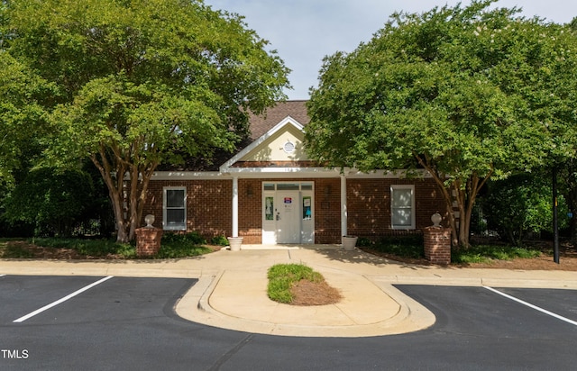 118 Killingsworth Dr, Cary, NC 27518 - view of front of house with brick siding and uncovered parking