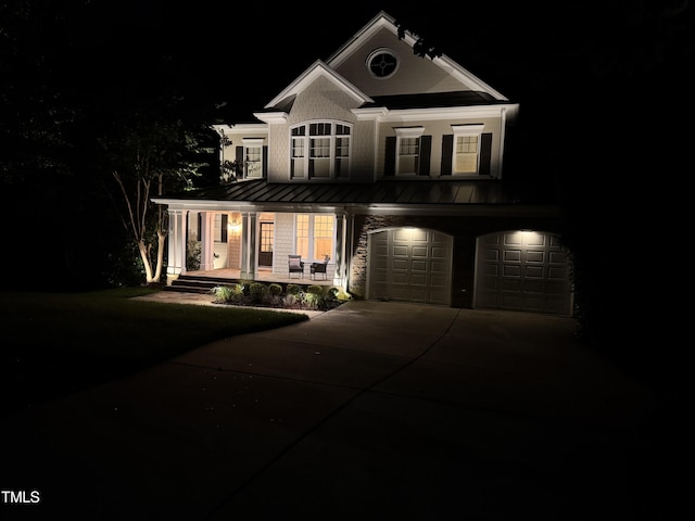 118 Killingsworth Dr, Cary, NC 27518 - neoclassical / greek revival house with a standing seam roof, covered porch, a garage, driveway, and metal roof