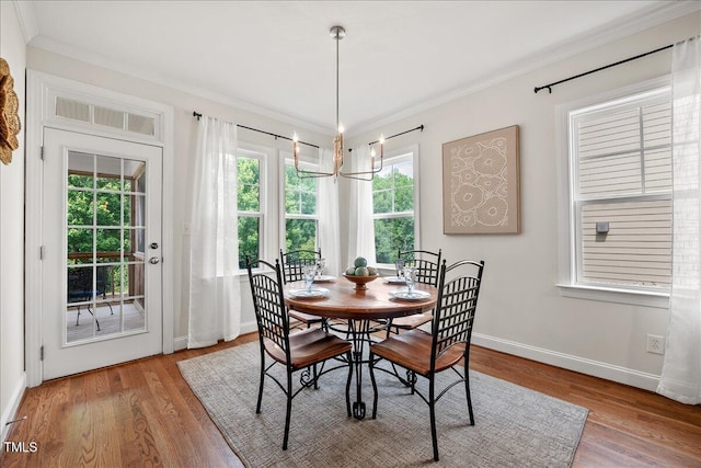 2256 Toad Hollow Trl, Apex, NC 27502 - dining room with ornamental molding, wood finished floors, and baseboards