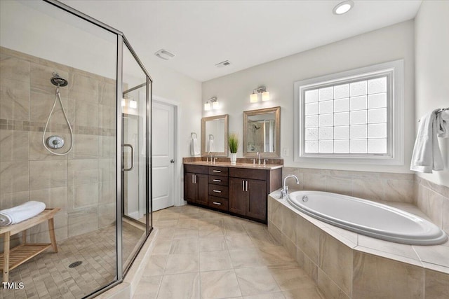 2256 Toad Hollow Trl, Apex, NC 27502 - bathroom featuring a stall shower, double vanity, and a garden tub