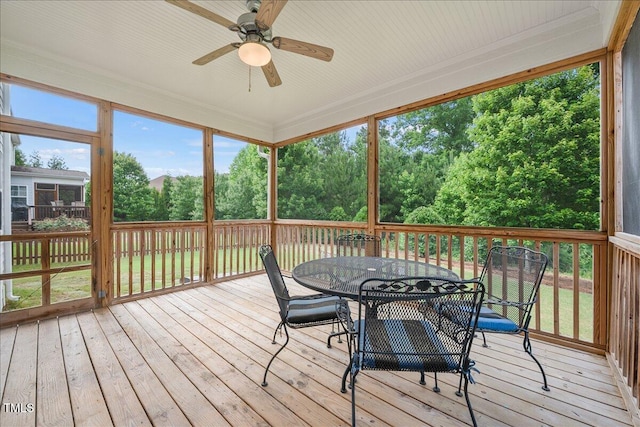 2256 Toad Hollow Trl, Apex, NC 27502 - sunroom with ceiling fan, outdoor dining space, and view of wooded area