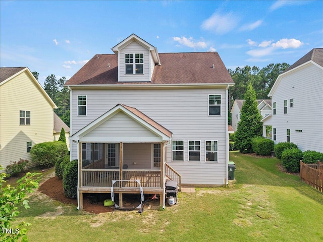 2256 Toad Hollow Trl, Apex, NC 27502 - rear view of property with a sunroom, a lawn, and roof with shingles