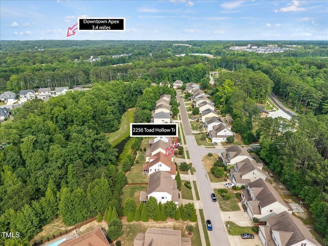 2256 Toad Hollow Trl, Apex, NC 27502 - aerial perspective of suburban area with a heavily wooded area