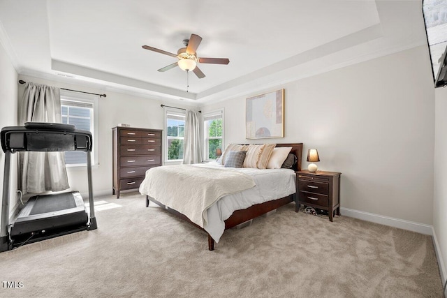 2256 Toad Hollow Trl, Apex, NC 27502 - bedroom featuring a tray ceiling, baseboards, carpet flooring, and a ceiling fan