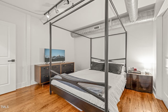 1535 Caraleigh Mills Ct Unit 210, Raleigh, NC 27603 - bedroom with wood-type flooring and track lighting