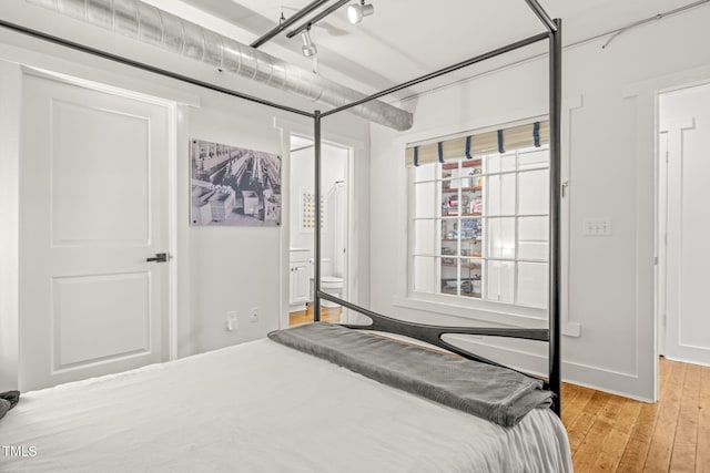 1535 Caraleigh Mills Ct Unit 210, Raleigh, NC 27603 - bedroom featuring light wood-style flooring and ensuite bath