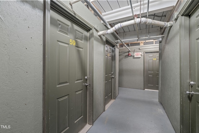 1535 Caraleigh Mills Ct Unit 210, Raleigh, NC 27603 - corridor with a textured wall and finished concrete floors