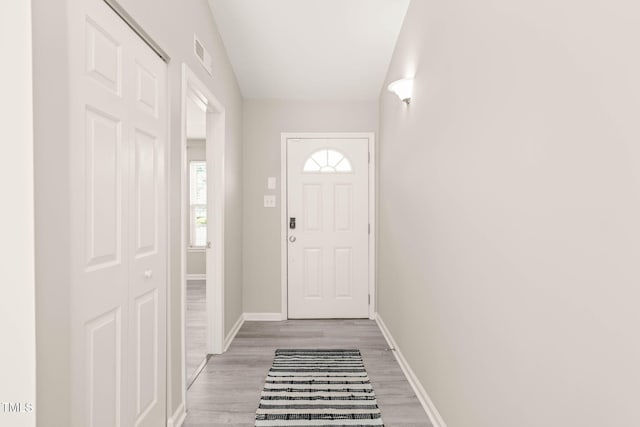 1375 Quail Cir, Creedmoor, NC 27522 - doorway to outside featuring baseboards and light wood-type flooring