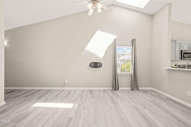 1375 Quail Cir, Creedmoor, NC 27522 - additional living space featuring a skylight, a ceiling fan, light wood-type flooring, baseboards, and high vaulted ceiling
