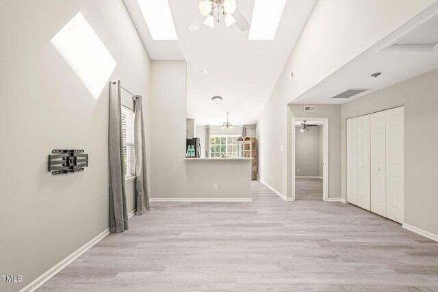 1375 Quail Cir, Creedmoor, NC 27522 - unfurnished living room with a ceiling fan, a skylight, and light wood-type flooring