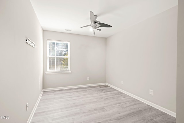1375 Quail Cir, Creedmoor, NC 27522 - spare room featuring ceiling fan, light wood-type flooring, and baseboards