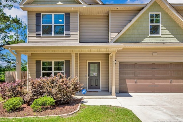 405 Shelton Beard Rd, Stedman, NC 28391 - view of front facade with a porch, driveway, and a garage