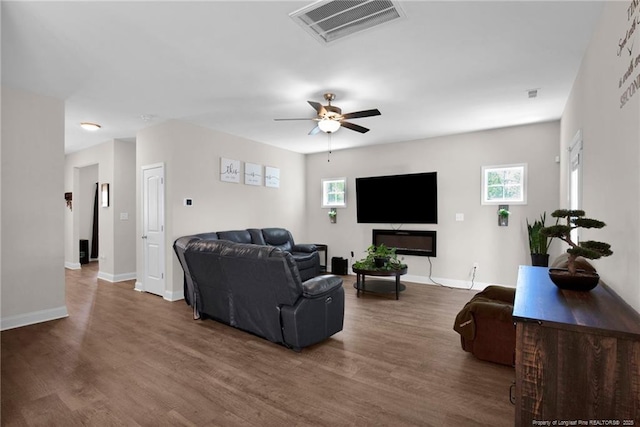 405 Shelton Beard Rd, Stedman, NC 28391 - living area featuring wood finished floors, a ceiling fan, and baseboards