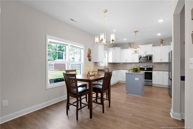 405 Shelton Beard Rd, Stedman, NC 28391 - dining area featuring a chandelier, baseboards, light wood-style flooring, and recessed lighting