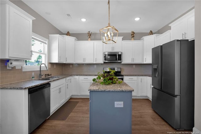 405 Shelton Beard Rd, Stedman, NC 28391 - kitchen featuring appliances with stainless steel finishes, a sink, a center island, white cabinetry, and recessed lighting