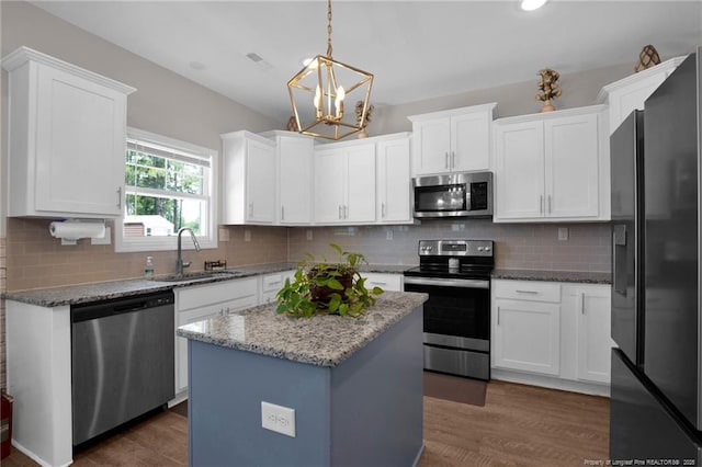 405 Shelton Beard Rd, Stedman, NC 28391 - kitchen featuring appliances with stainless steel finishes, a sink, a chandelier, white cabinetry, and recessed lighting