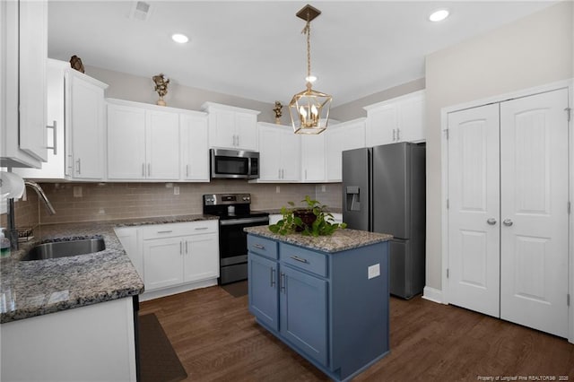 405 Shelton Beard Rd, Stedman, NC 28391 - kitchen with stainless steel appliances, a sink, white cabinetry, and recessed lighting