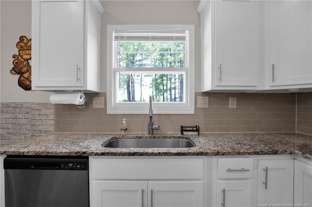 405 Shelton Beard Rd, Stedman, NC 28391 - kitchen featuring stainless steel dishwasher, a sink, white cabinetry, and backsplash