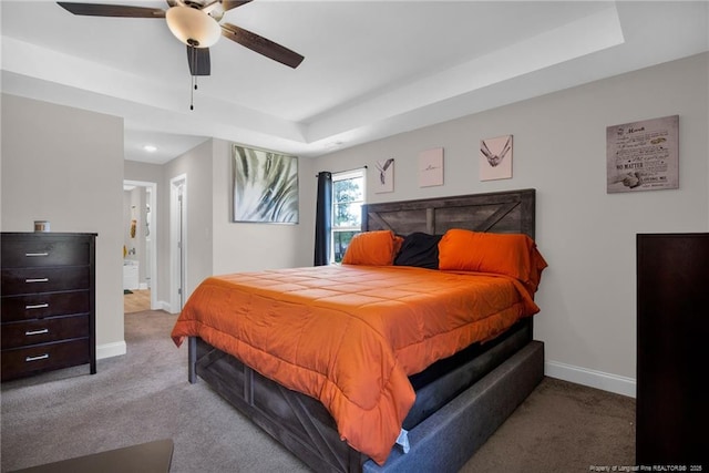 405 Shelton Beard Rd, Stedman, NC 28391 - carpeted bedroom featuring baseboards, a tray ceiling, and ceiling fan