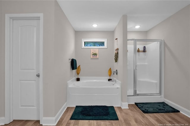 405 Shelton Beard Rd, Stedman, NC 28391 - full bath featuring a stall shower, baseboards, a bath, and wood finished floors