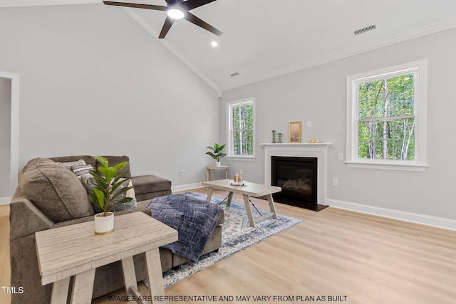 154 Buckaroo Dr, Louisburg, NC 27549 - living area featuring vaulted ceiling, ornamental molding, ceiling fan, wood finished floors, and baseboards