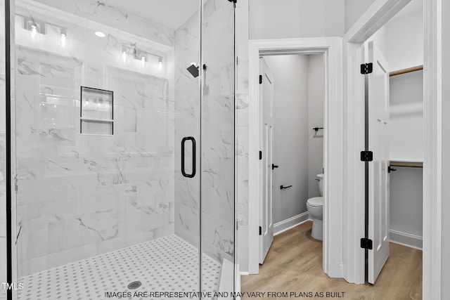 154 Buckaroo Dr, Louisburg, NC 27549 - full bath featuring toilet, a marble finish shower, and wood finished floors