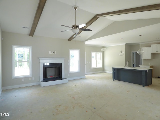 788 Shade Tree Rd, Benson, NC 27504 - unfurnished living room featuring a sink, healthy amount of natural light, and baseboards