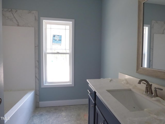 788 Shade Tree Rd, Benson, NC 27504 - full bathroom featuring vanity, a bath, baseboards, and unfinished concrete flooring