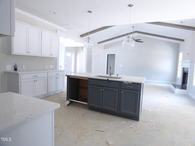 788 Shade Tree Rd, Benson, NC 27504 - kitchen with a sink, white cabinets, pendant lighting, a fireplace with raised hearth, and an island with sink