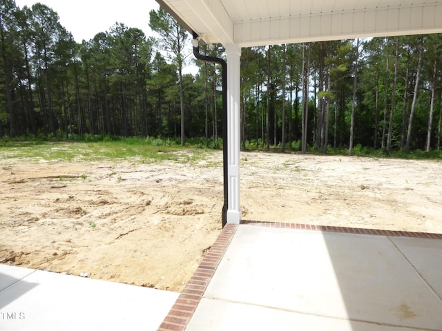 788 Shade Tree Rd, Benson, NC 27504 - view of yard with a wooded view
