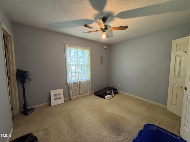 8405 Falcon Crest Cir, Angier, NC 27501 - unfurnished bedroom with carpet flooring, a ceiling fan, a textured ceiling, and baseboards