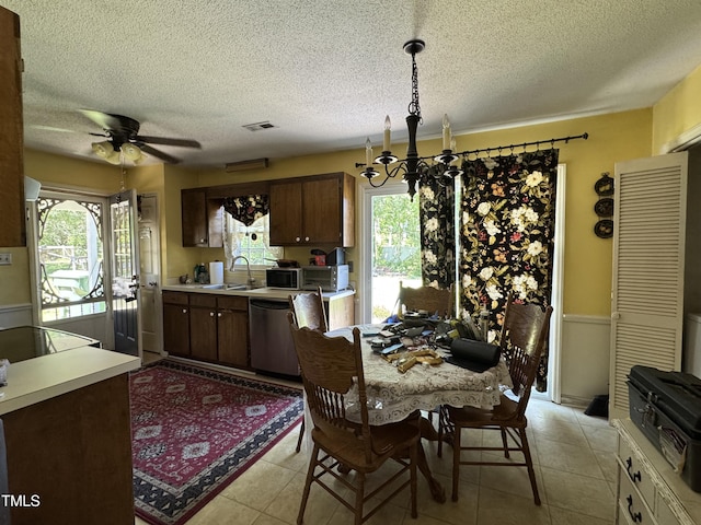 8405 Falcon Crest Cir, Angier, NC 27501 - dining space featuring a textured ceiling, a chandelier, a ceiling fan, and light tile patterned floors