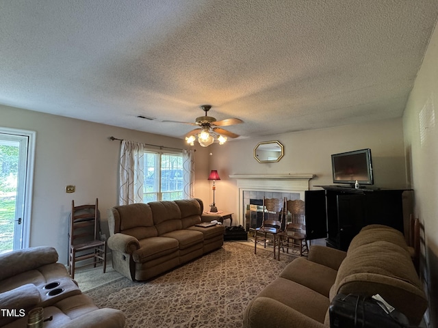 8405 Falcon Crest Cir, Angier, NC 27501 - living room with a textured ceiling, healthy amount of natural light, and ceiling fan