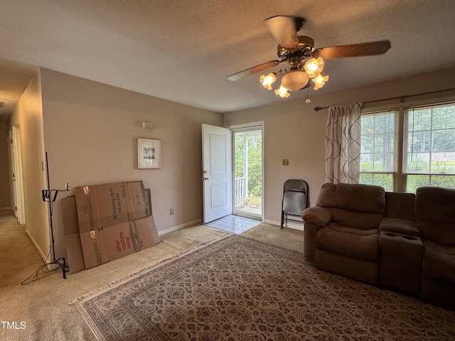 8405 Falcon Crest Cir, Angier, NC 27501 - carpeted living room featuring ceiling fan and a textured ceiling