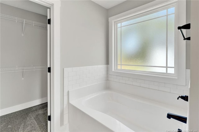 4037 Fulford Mcmillan Rd, Raeford, NC 28376 - full bathroom with a garden tub, a spacious closet, and baseboards