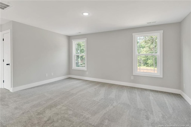 4037 Fulford Mcmillan Rd, Raeford, NC 28376 - carpeted empty room featuring healthy amount of natural light, baseboards, and recessed lighting